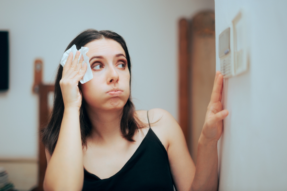 Woman,Felling,Hot,During,Summer,Setting,Her,Thermostat.,Person,Adjusting