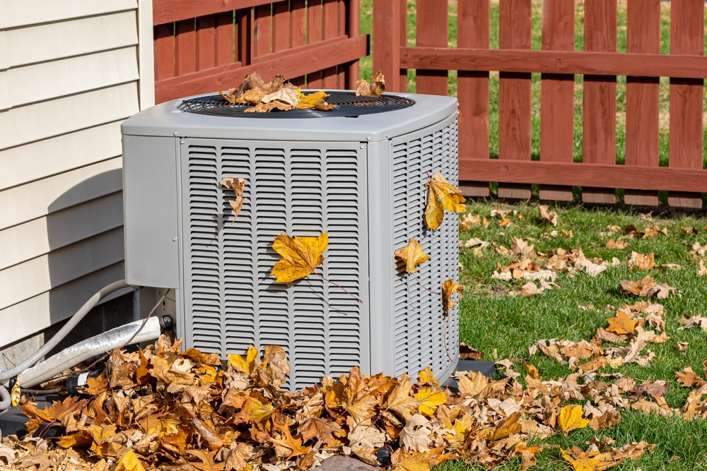 Dirty,Air,Conditioning,Unit,Covered,In,Leaves,During,Autumn.,Home